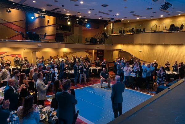 Standing ovation as Rob Steigerwald congratulates Bill Mace at the ARCO 2020 Elite Project Partners Dinner